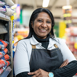 woman at her new job as a grocery clerk